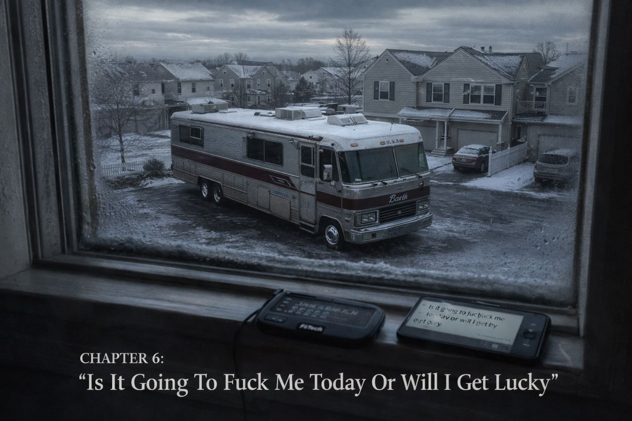 View through a frosted second-storey window down onto a snow-covered driveway where a long grey and maroon Barth motorhome sits, with identical suburban houses and a flat grey winter sky beyond. On the windowsill in the foreground, a FiTech handheld diagnostic unit and a phone showing a message.